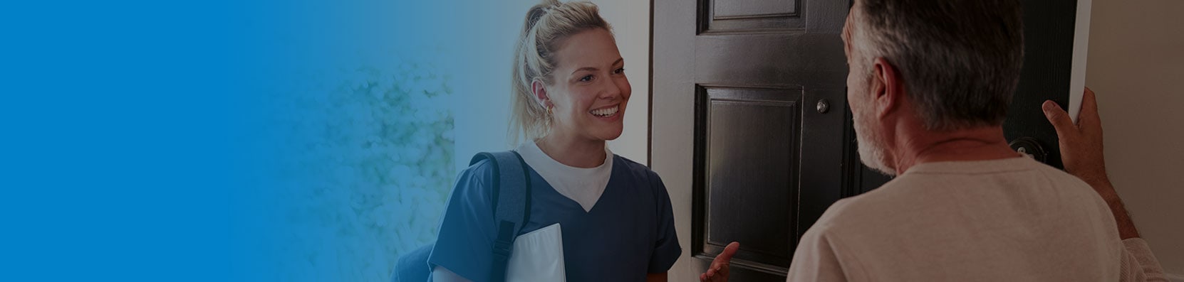 man greeting young female podiatrist at home